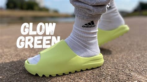 glow green yeezy slides outfit.